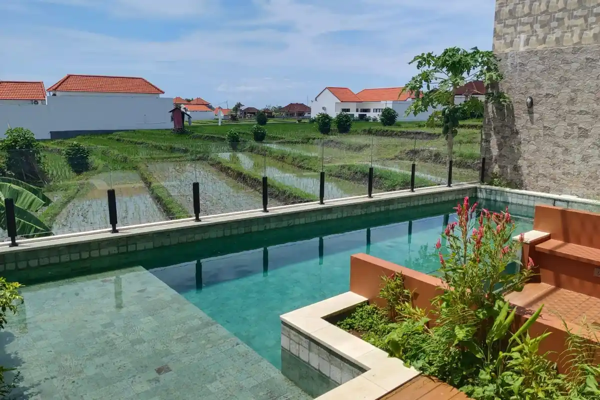 Villa pool overlooking green fields and neighbouring houses